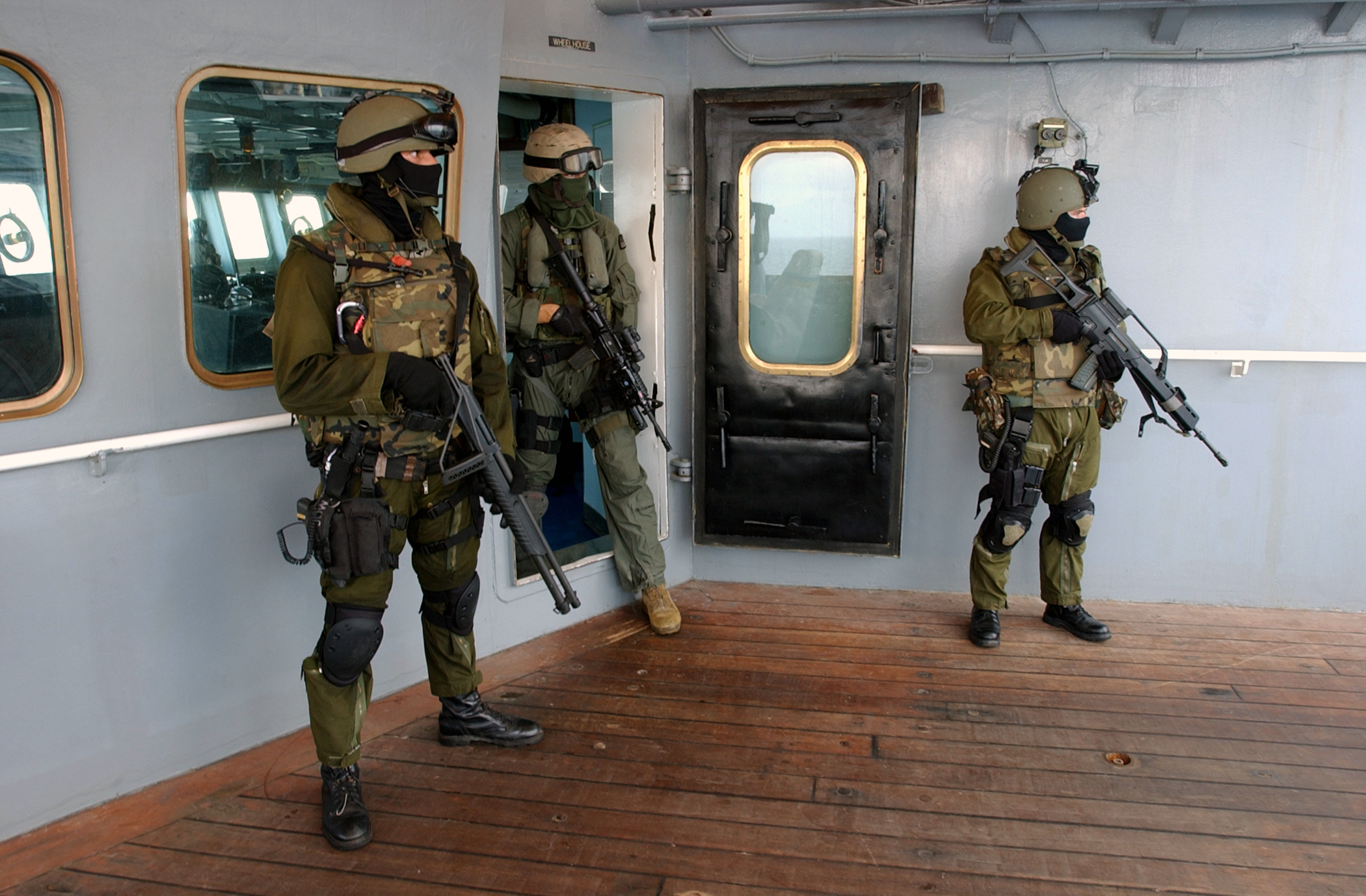 US Navy 040117-N-0331L-021 Spanish Special Operations Forces (SOF) soldiers partner with a U.S. Marine assigned to the 13th Marine Expeditionary Unit (13th MEU) after searching the Military Sealift Command (MSC) combat stores s.jpg